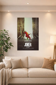 Joker (Joaquin Phoenix) in a bright living room above a beige sofa.