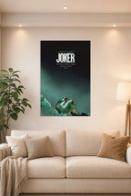 Joker (Joaquin Phoenix) in a bright living room above a beige sofa.
