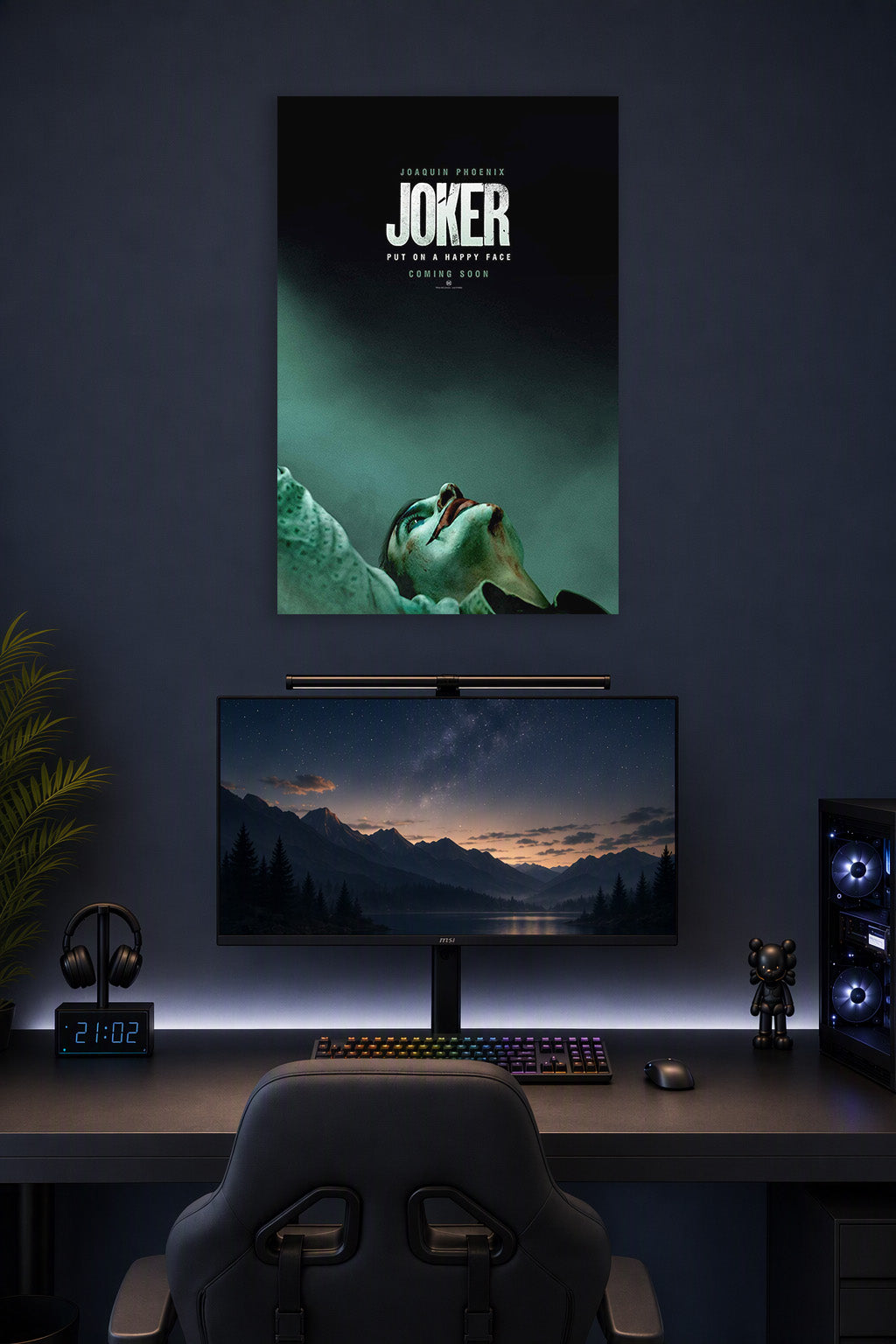 Joker (Joaquin Phoenix) in a gaming desk setup above a monitor.