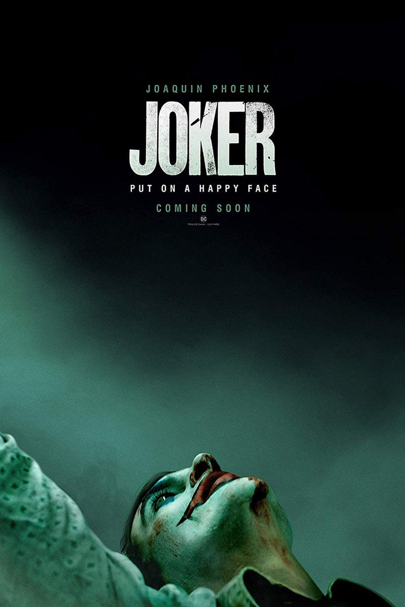 Joker poster features Joaquin Phoenix lying back in clown makeup beneath white title text on a dark teal background.