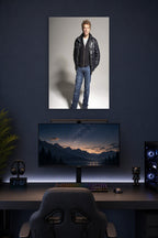 Jon Bon Jovi in a gaming desk setup above a monitor.