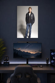 Jon Bon Jovi in a gaming desk setup above a monitor.