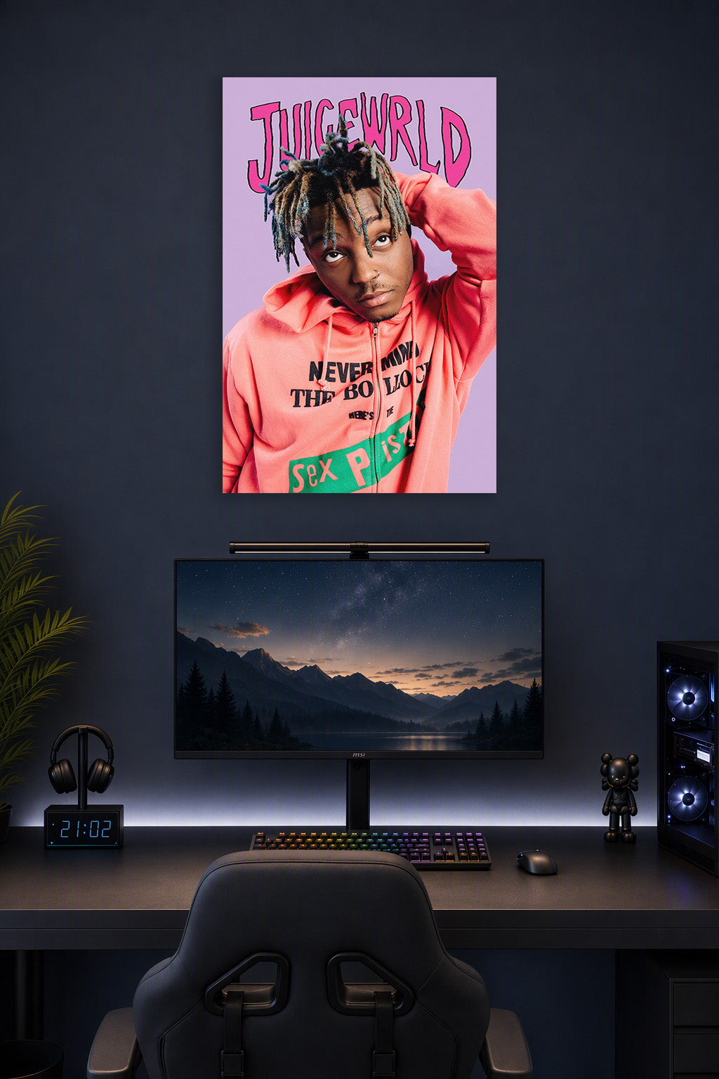 Juice Wrld in a gaming desk setup above a monitor.