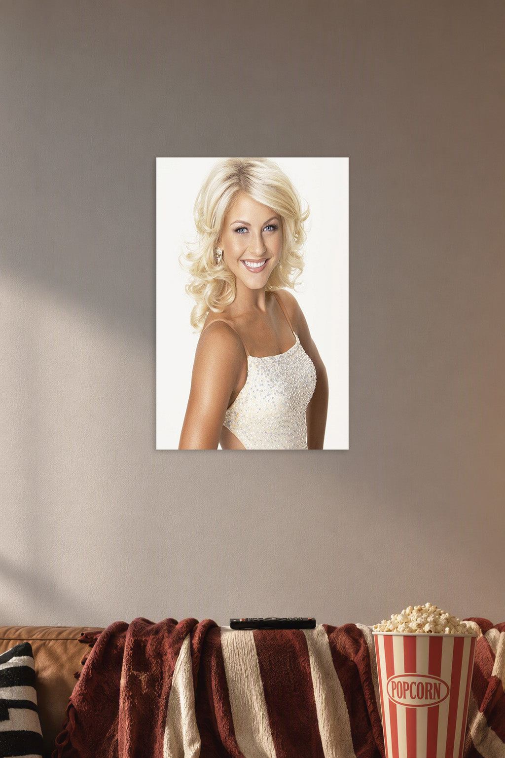 Julianne Hough in a cozy movie room above a brown sofa with popcorn.