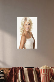 Julianne Hough in a cozy movie room above a brown sofa with popcorn.