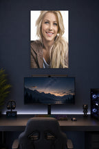 Julianne Hough in a gaming desk setup above a monitor.