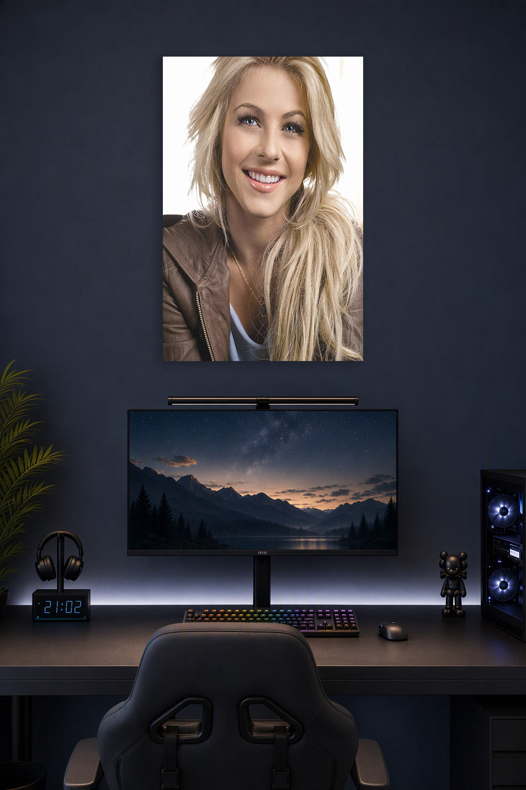 Julianne Hough in a gaming desk setup above a monitor.