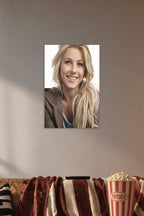Julianne Hough in a cozy movie room above a brown sofa with popcorn.