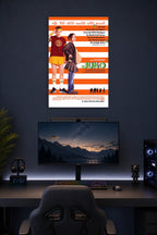Juno Movies in a gaming desk setup above a monitor.