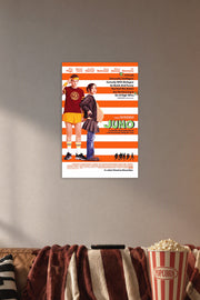 Juno Movies in a cozy movie room above a brown sofa with popcorn.