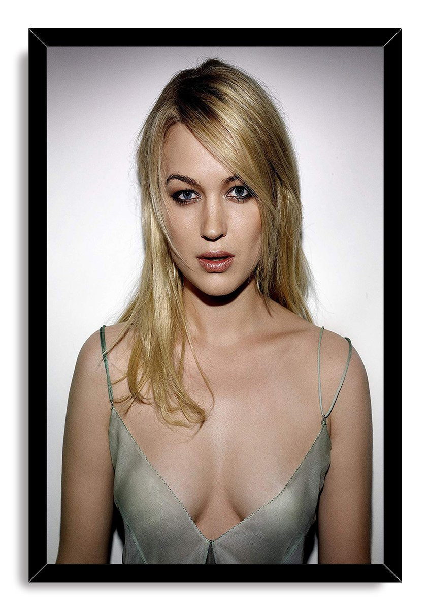 Juno Temple framed wall art print features her close blonde portrait in a pale green dress within a black frame.