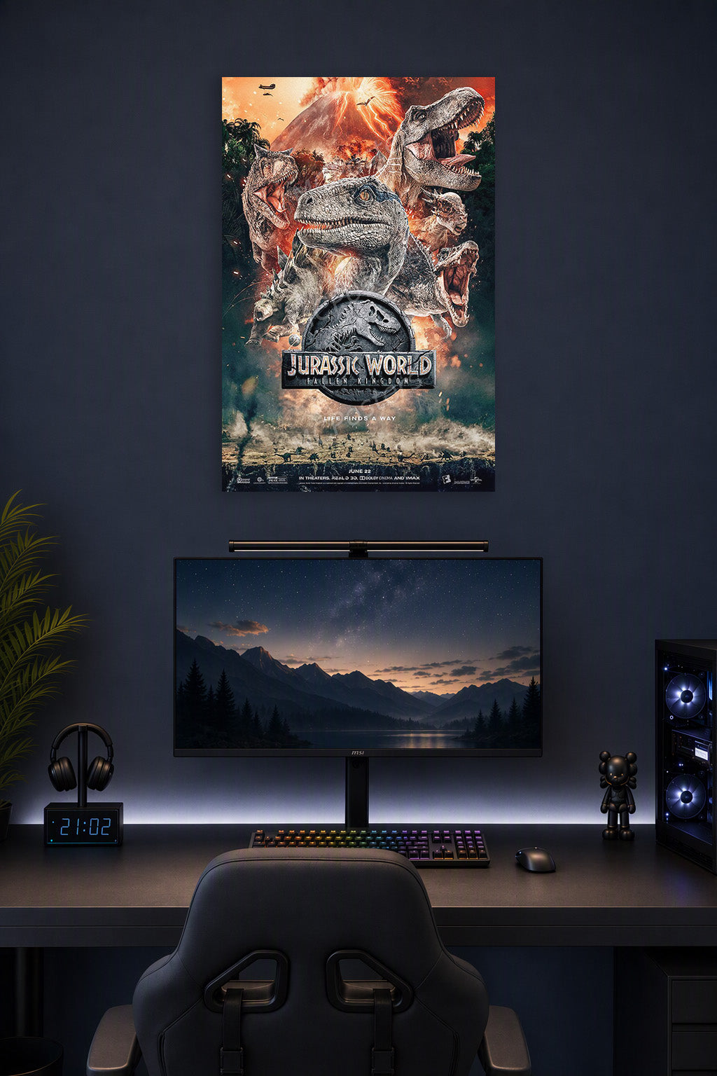 Jurassic World Dinosaurs in a gaming desk setup above a monitor.