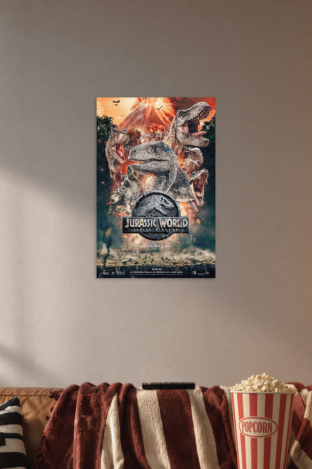Jurassic World Dinosaurs in a cozy movie room above a brown sofa with popcorn.