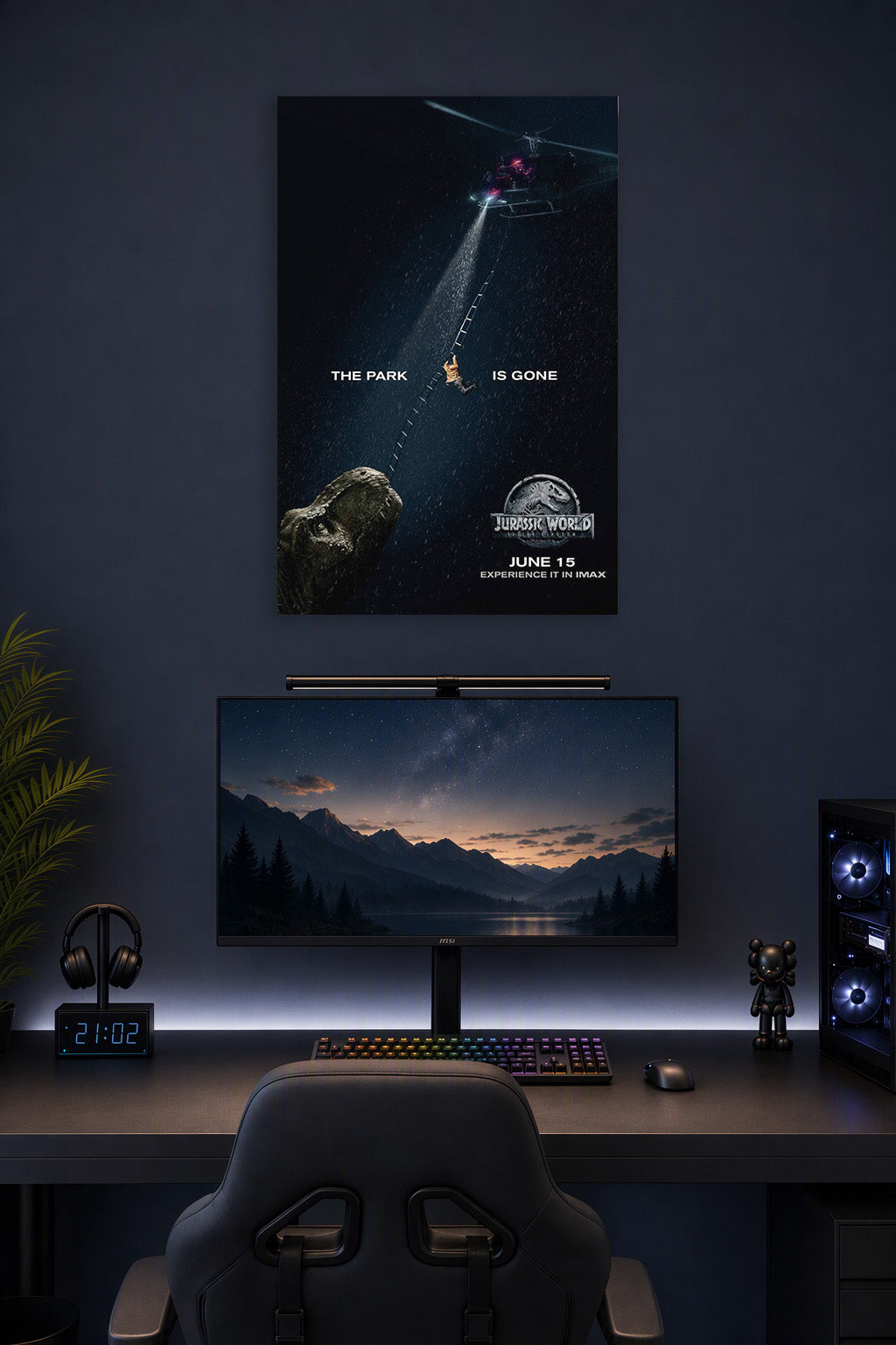 Jurassic World Fallen Kingdom Movie Poster in a gaming desk setup above a monitor.