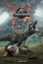 Jurassic World Fallen Kingdom wall art print depicts a T-Rex roaring above survivors beside a gyrosphere under an erupting volcano.