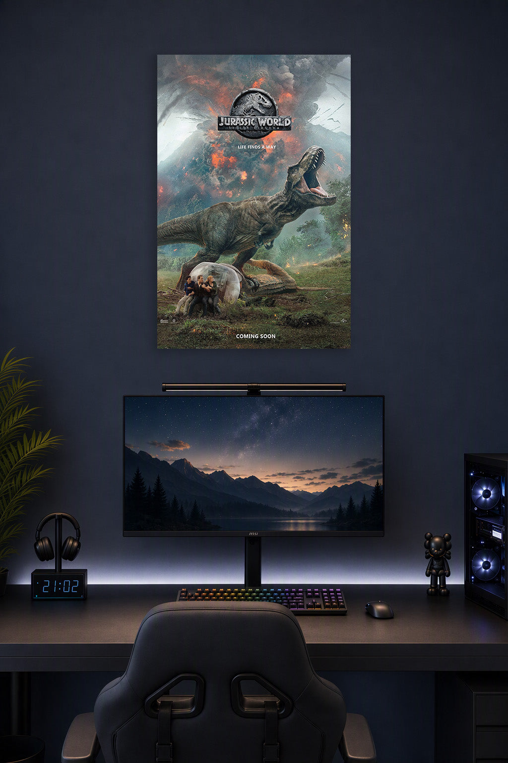 Jurassic World Fallen Kingdom T-Rex in a gaming desk setup above a monitor.