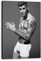 Justin Bieber canvas wall art print displays a monochrome tattooed portrait with clasped hands against a plain gray backdrop.