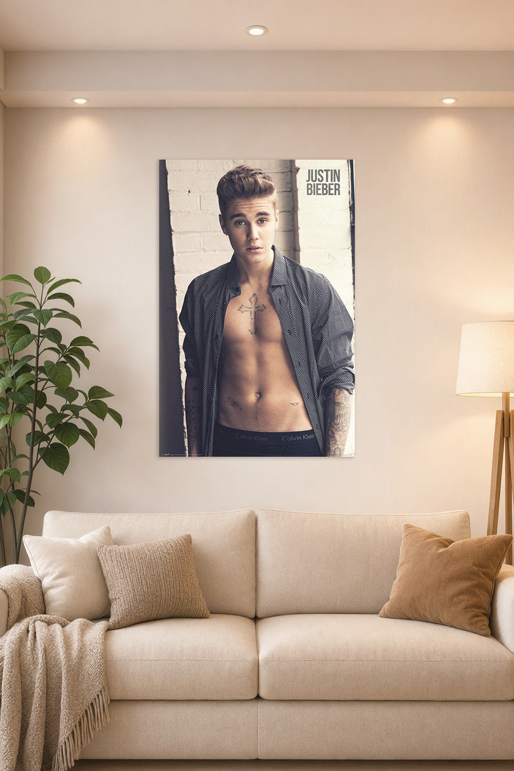 Justin Bieber in a bright living room above a beige sofa.