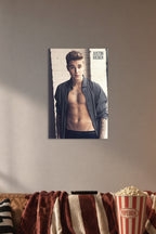 Justin Bieber in a cozy movie room above a brown sofa with popcorn.