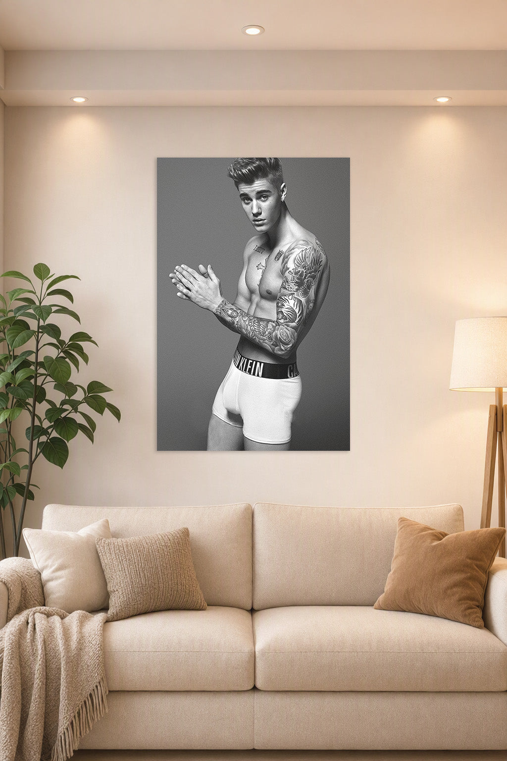 Justin Bieber in a bright living room above a beige sofa.