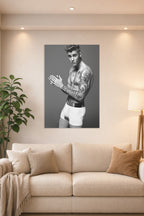 Justin Bieber in a bright living room above a beige sofa.