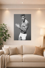 Justin Bieber in a bright living room above a beige sofa.