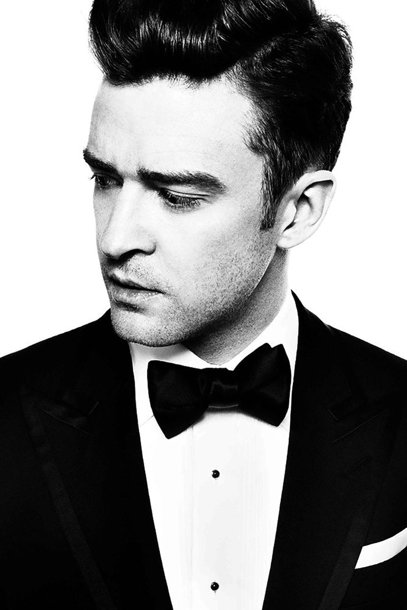 Justin Timberlake wall art print features a black-and-white close portrait of the singer in a tuxedo and bow tie.