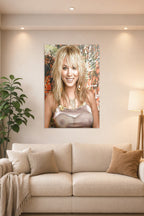Kaley Cuoco in a bright living room above a beige sofa.