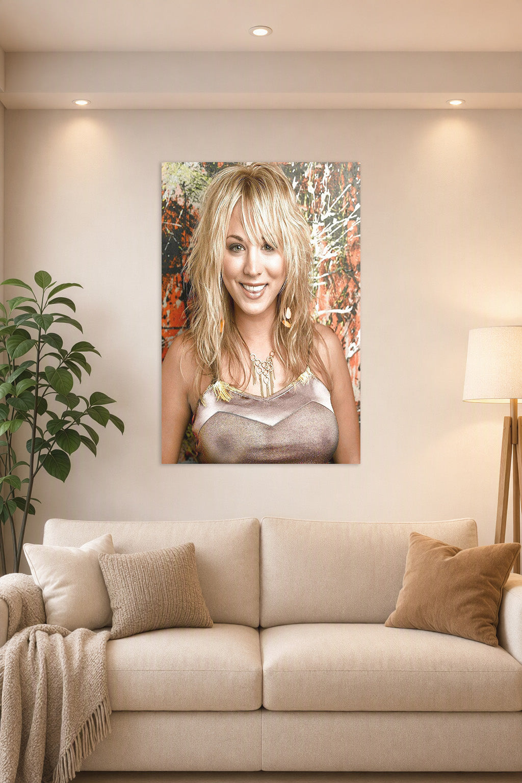 Kaley Cuoco in a bright living room above a beige sofa.
