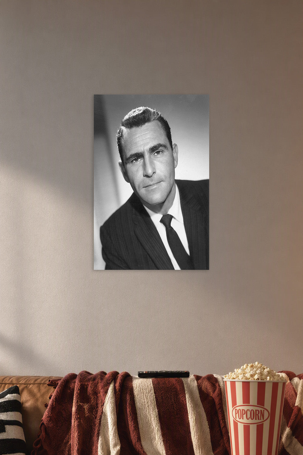 Karl Malden in a cozy movie room above a brown sofa with popcorn.