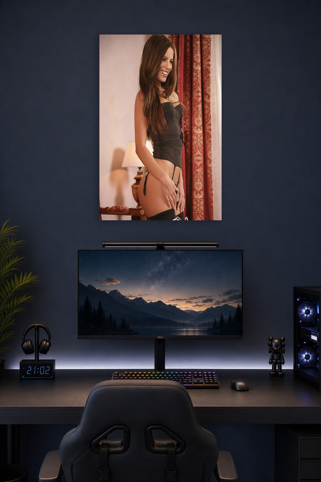 Kate Beckinsale in a gaming desk setup above a monitor.