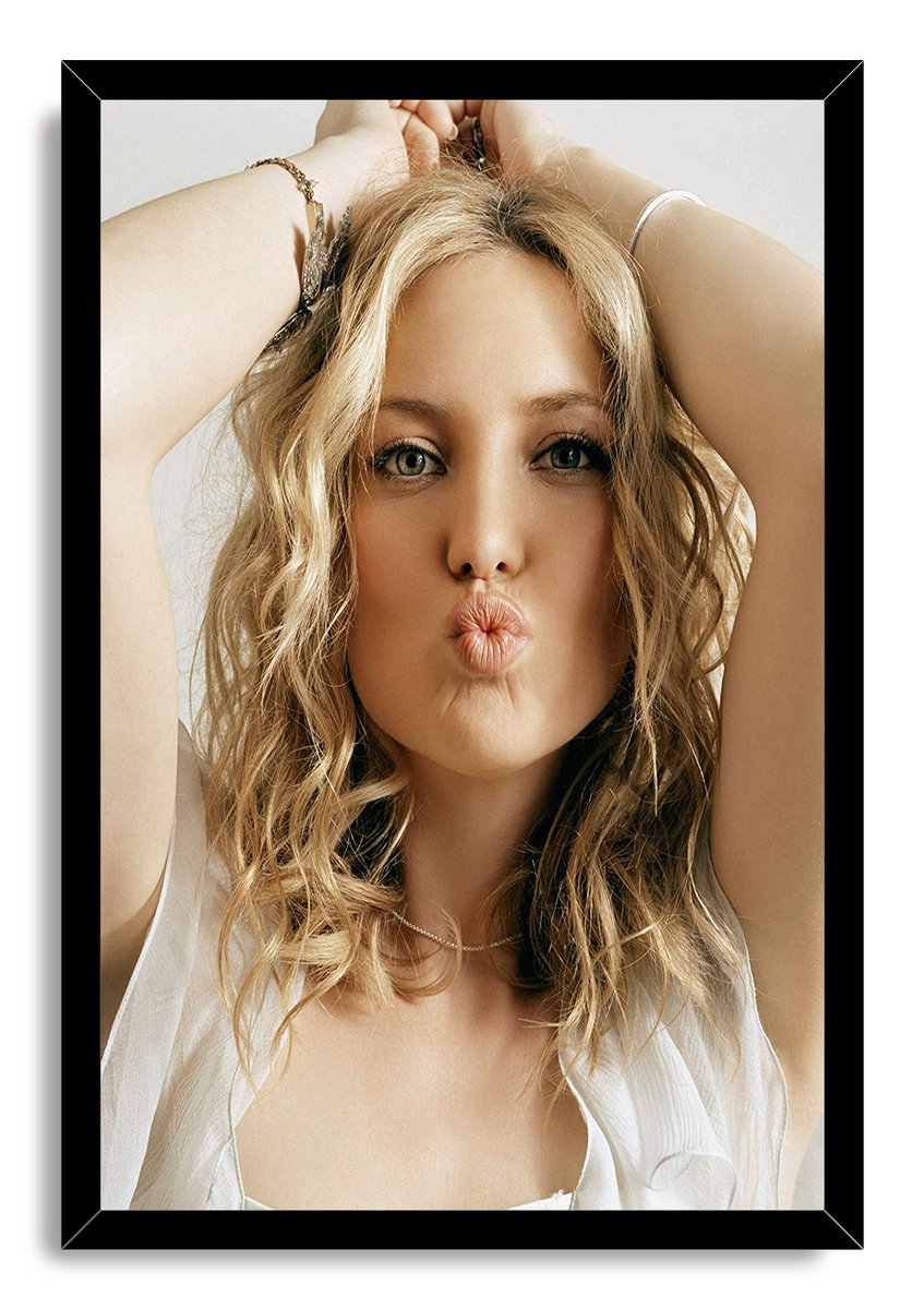 Kate Hudson framed wall art print in a black border, portraying her with tousled blonde hair, raised arms, and pursed lips.