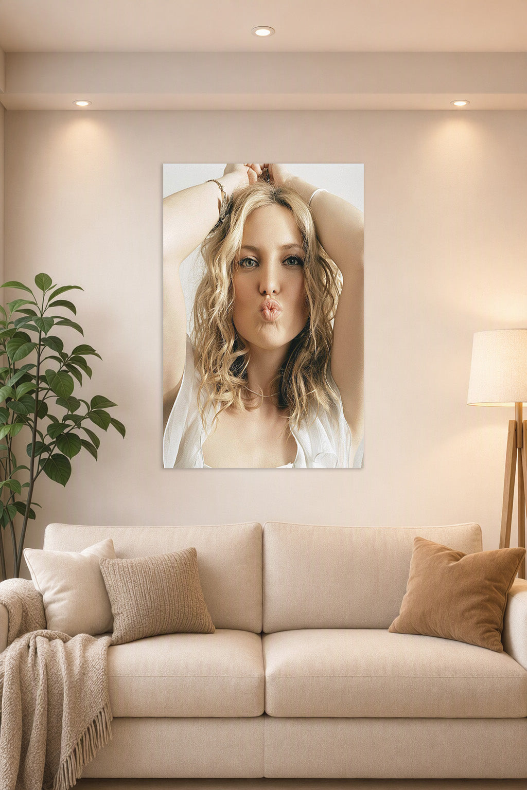 Kate Hudson in a bright living room above a beige sofa.