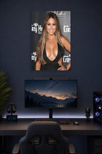 Katie Daryl in a gaming desk setup above a monitor.