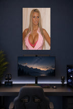 Katie Price in a gaming desk setup above a monitor.