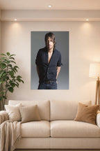 Keith Urban in a bright living room above a beige sofa.