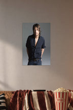 Keith Urban in a cozy movie room above a brown sofa with popcorn.