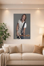Keith Urban in a bright living room above a beige sofa.