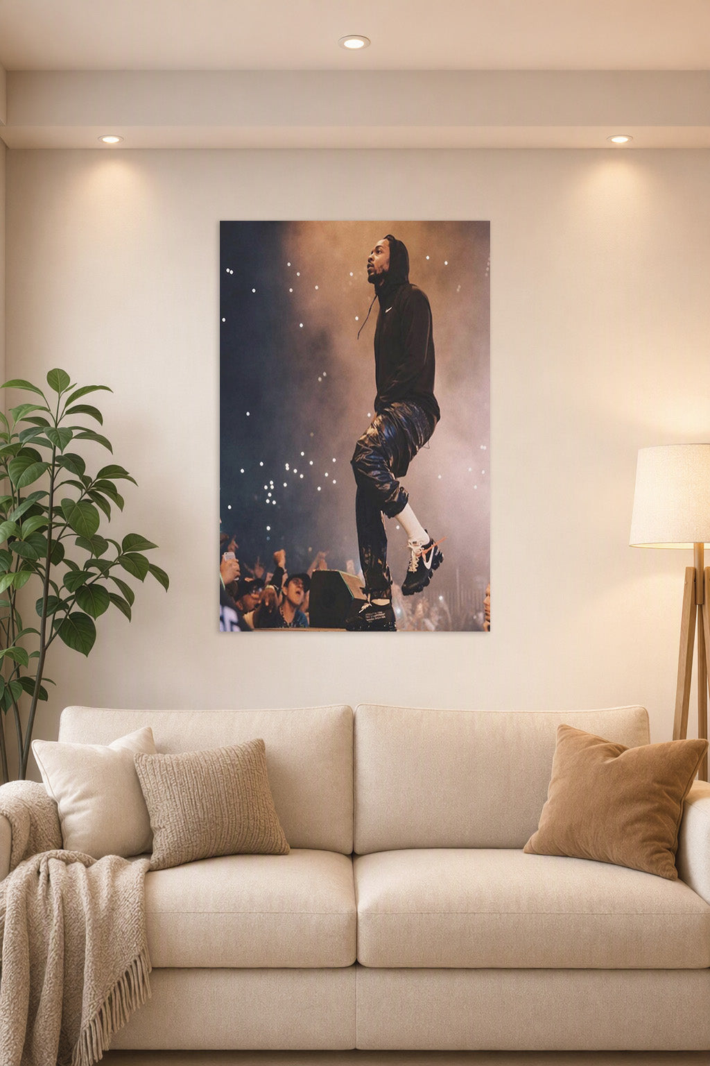 Kendrick Lamar in a bright living room above a beige sofa.