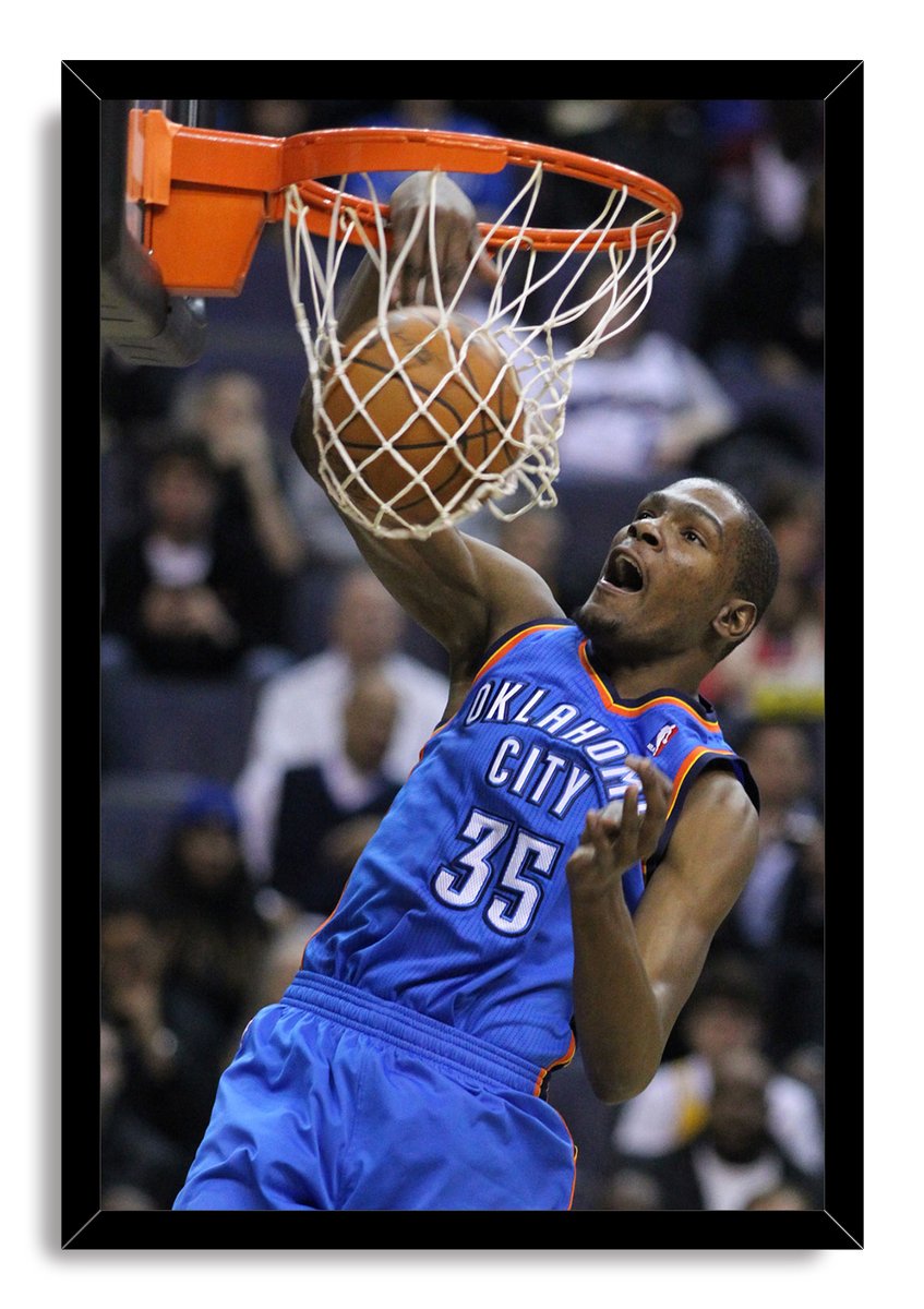 Kevin Durant framed wall art print depicts the Oklahoma City number 35 player dunking through a white net, set in a black frame.