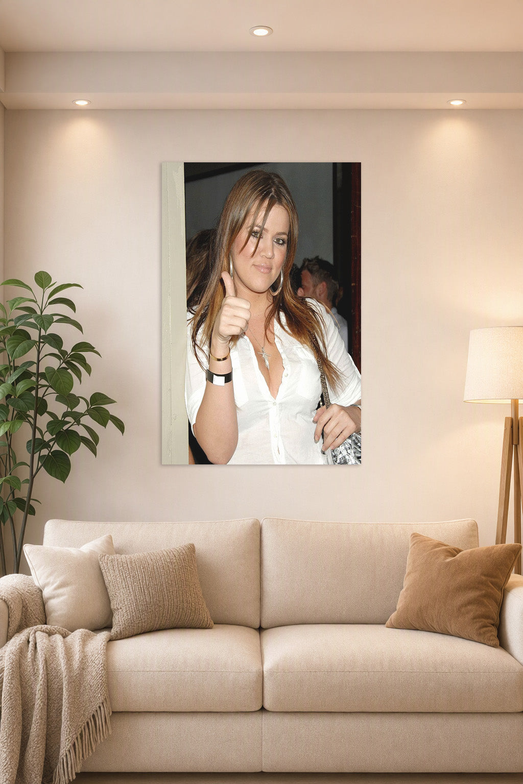Khloé Kardashian in a bright living room above a beige sofa.