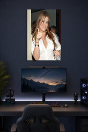 Khloé Kardashian in a gaming desk setup above a monitor.