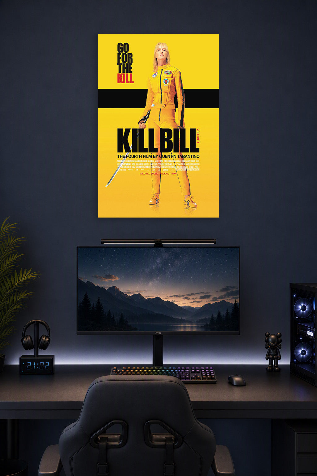 Kill Bill The Bride in a gaming desk setup above a monitor.