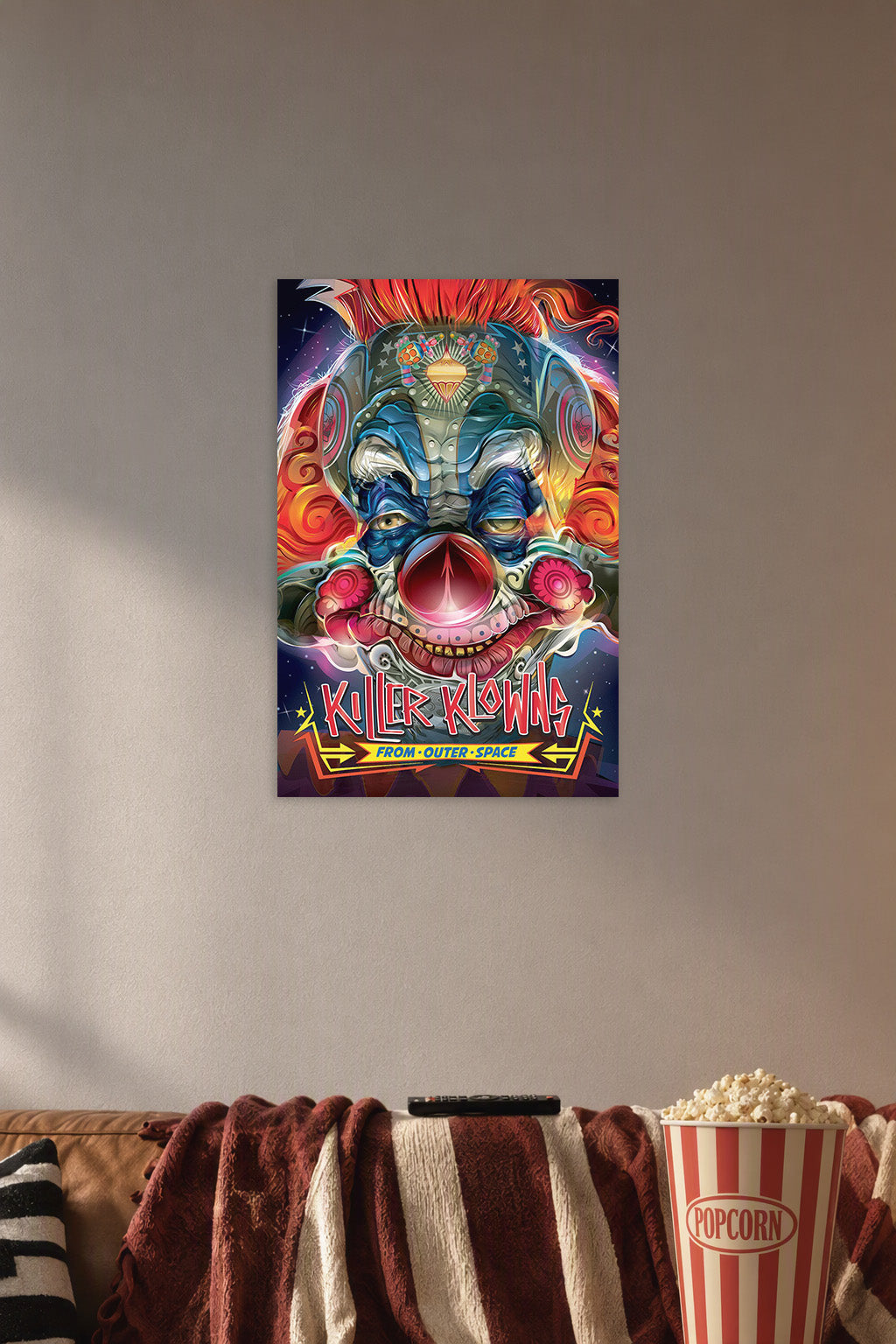 Killer Klowns From Outer Space in a cozy movie room above a brown sofa with popcorn.