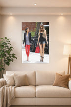Kim and Khloé Kardashian in a bright living room above a beige sofa.