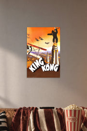 King Kong in a cozy movie room above a brown sofa with popcorn.