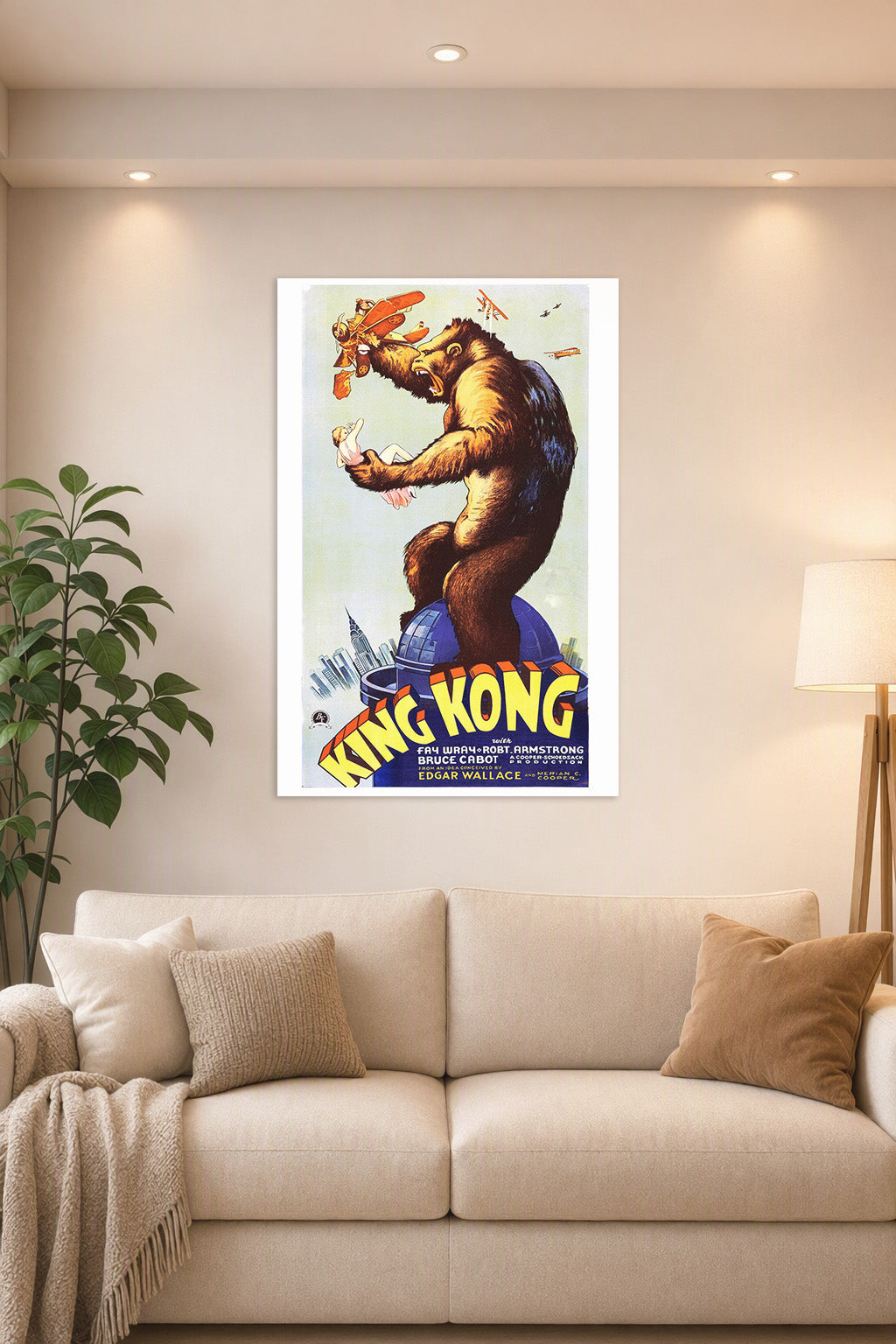 King Kong in a bright living room above a beige sofa.