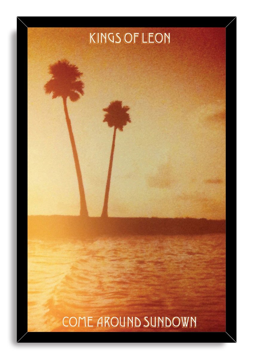 Kings of Leon Come Around Sundown framed wall art print depicting two palm trees over reflective orange water at sunset.