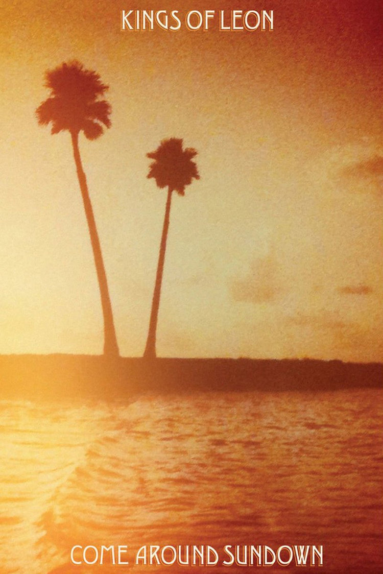 Kings of Leon Come Around Sundown poster featuring two silhouetted palm trees above glowing sunset water in amber and red tones.