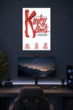 Kinky Boots Musical Red Boots in a gaming desk setup above a monitor.
